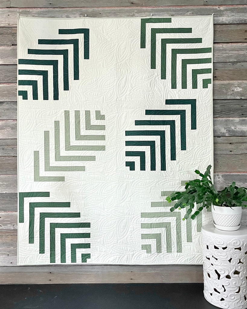 Throw size quilt featuring 6 large modern leaves.